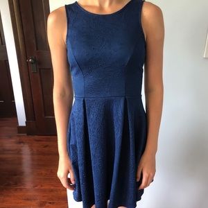 A blue mini dress with flowered details.